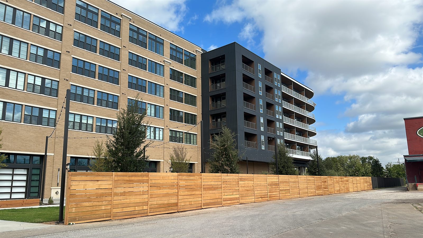 Wood privacy fence along a driveway